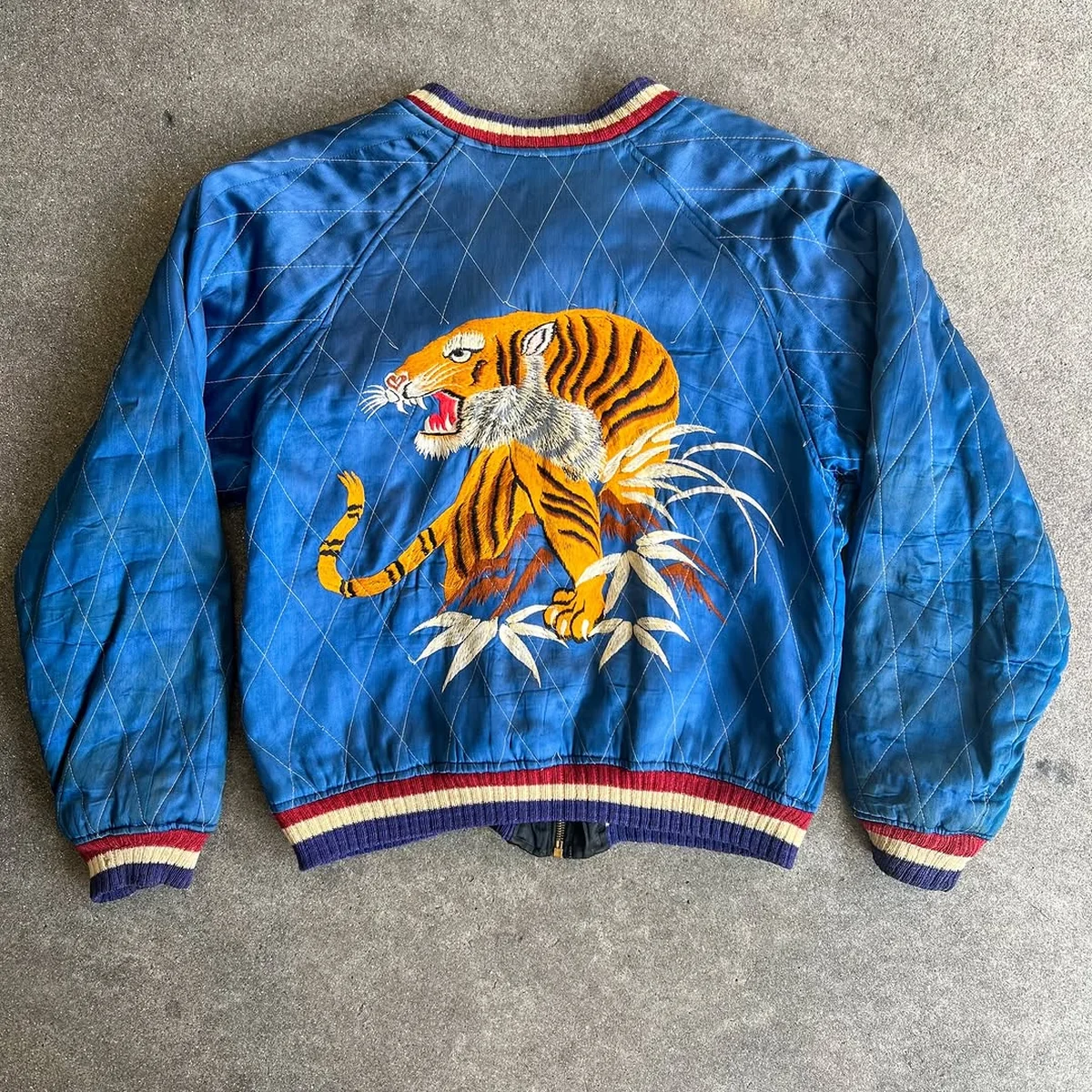 Blue souvenir jacket with an embroidered tiger